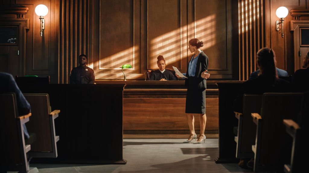 court of justice and law trial: successful female public defender presenting the case, making passionate speech to judge, jury. attorney lawyer protecting client with closing not guilty arguments.